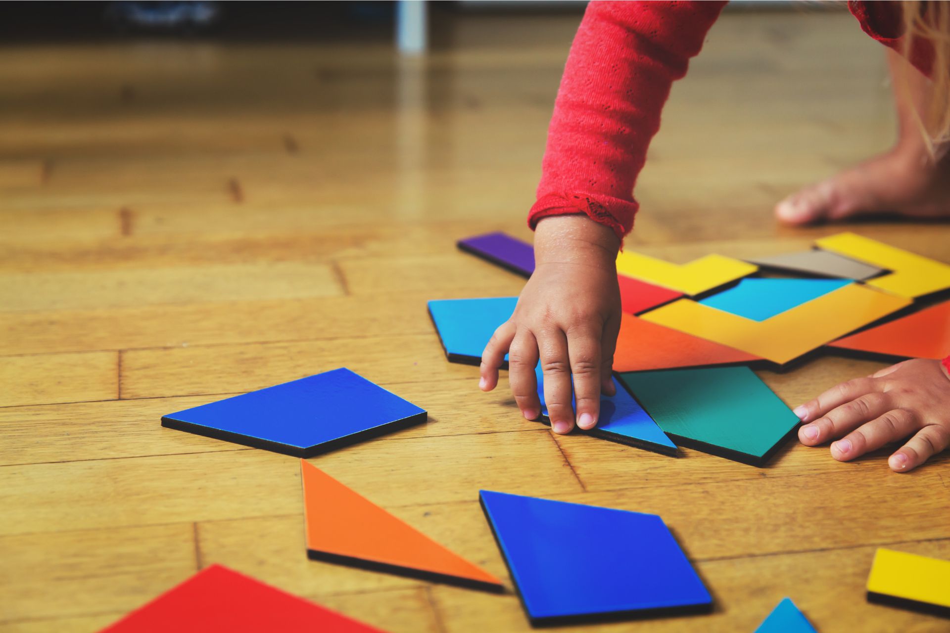 Toddler playing with shapes and colors